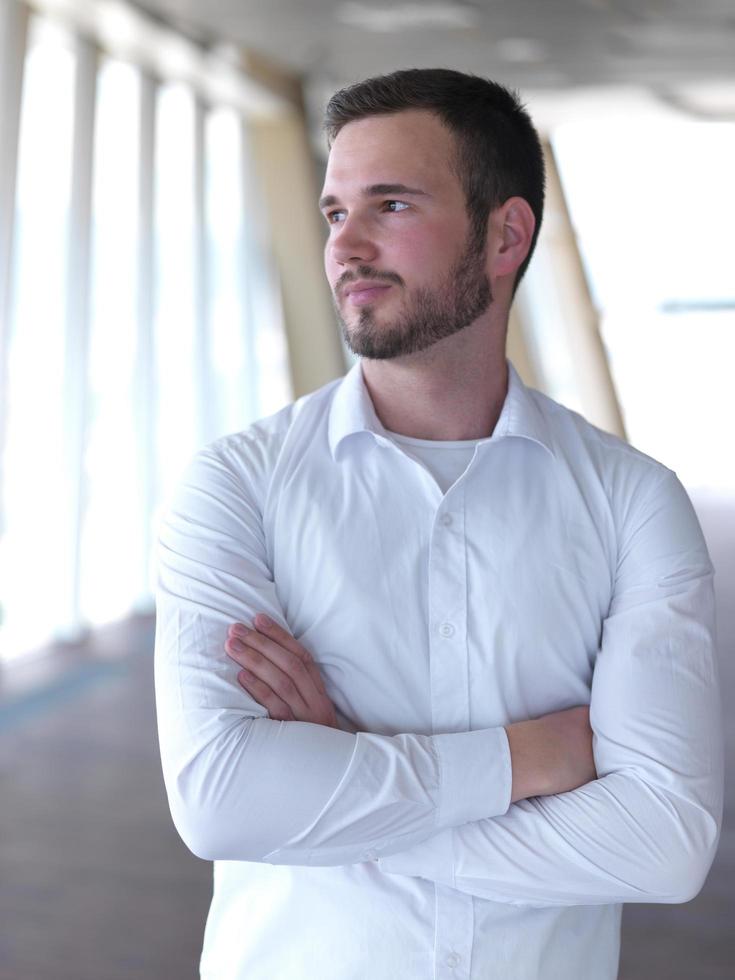 portrait of young  business man with beard at modern office photo