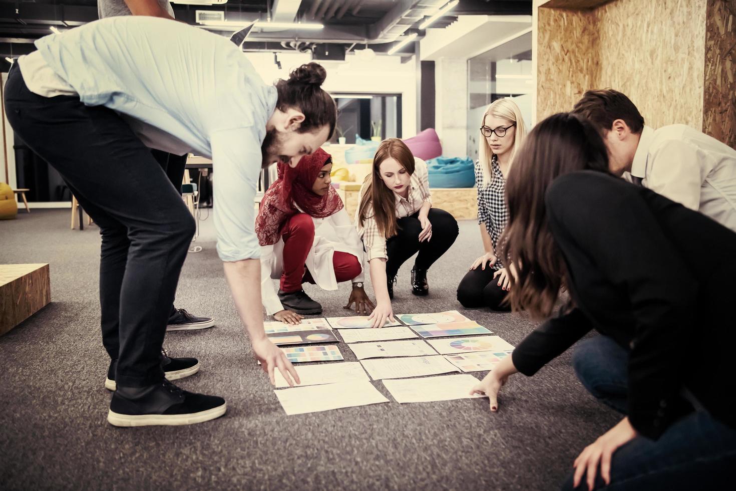 black muslim woman having meeting with Multiethnic  startup business team photo