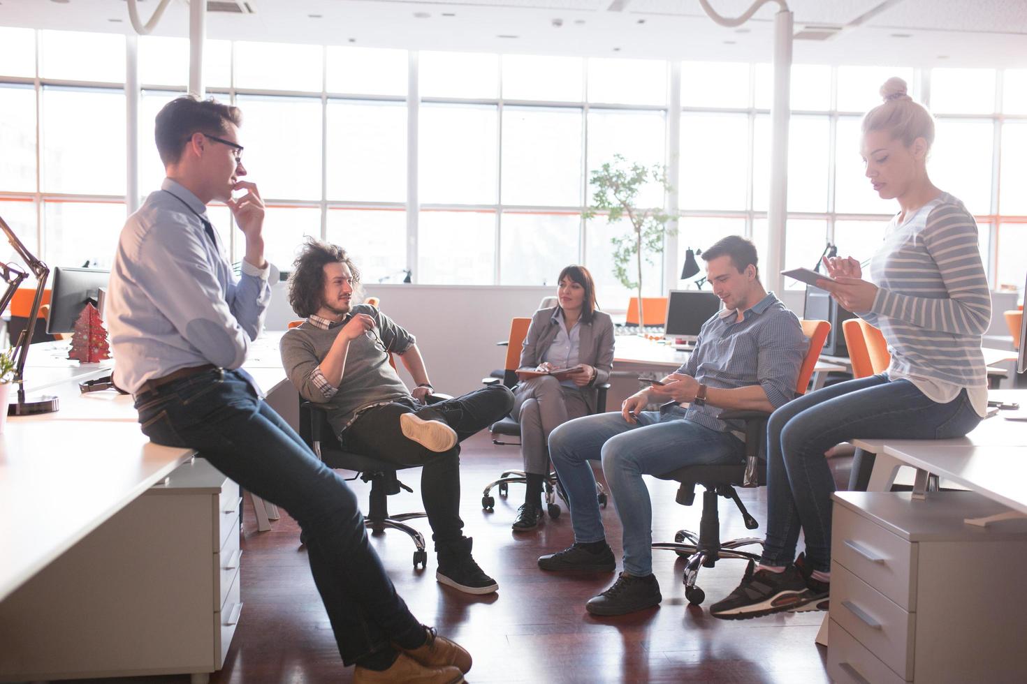 Young Business Team At A Meeting at modern office building photo