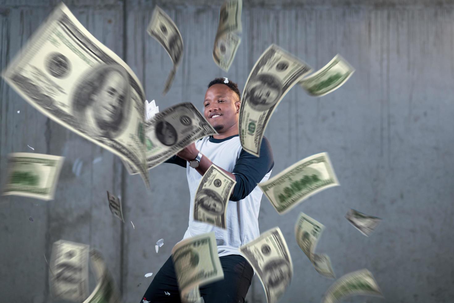 black businessman making the rain of money photo