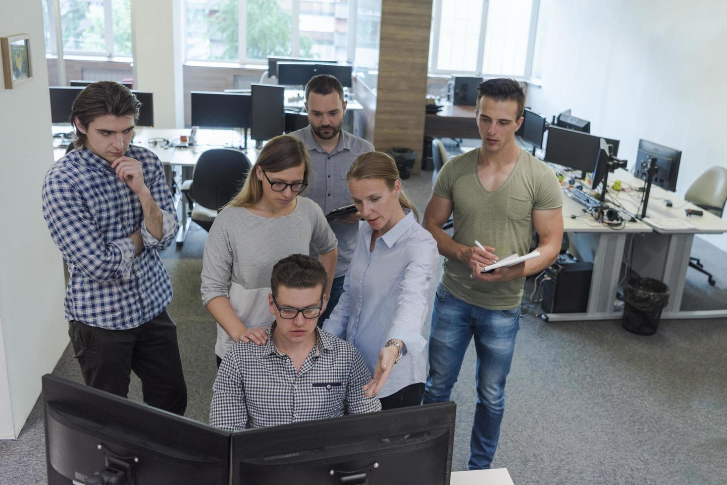 startup business people group working as team to find solution photo