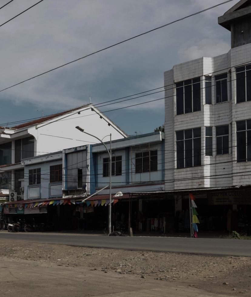 Shophouse buildings where traders sell, are taken with a lying layout photo