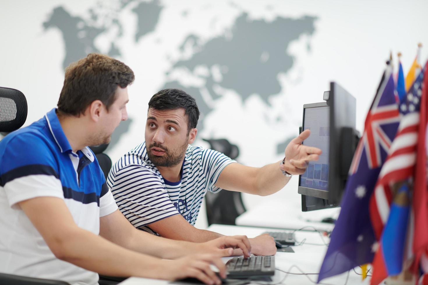 two male software developers working on computer photo