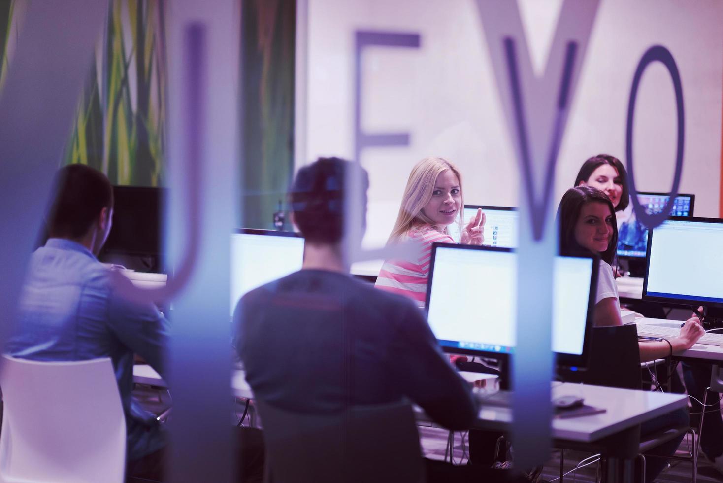 technology students group working  in computer lab school  classroom photo
