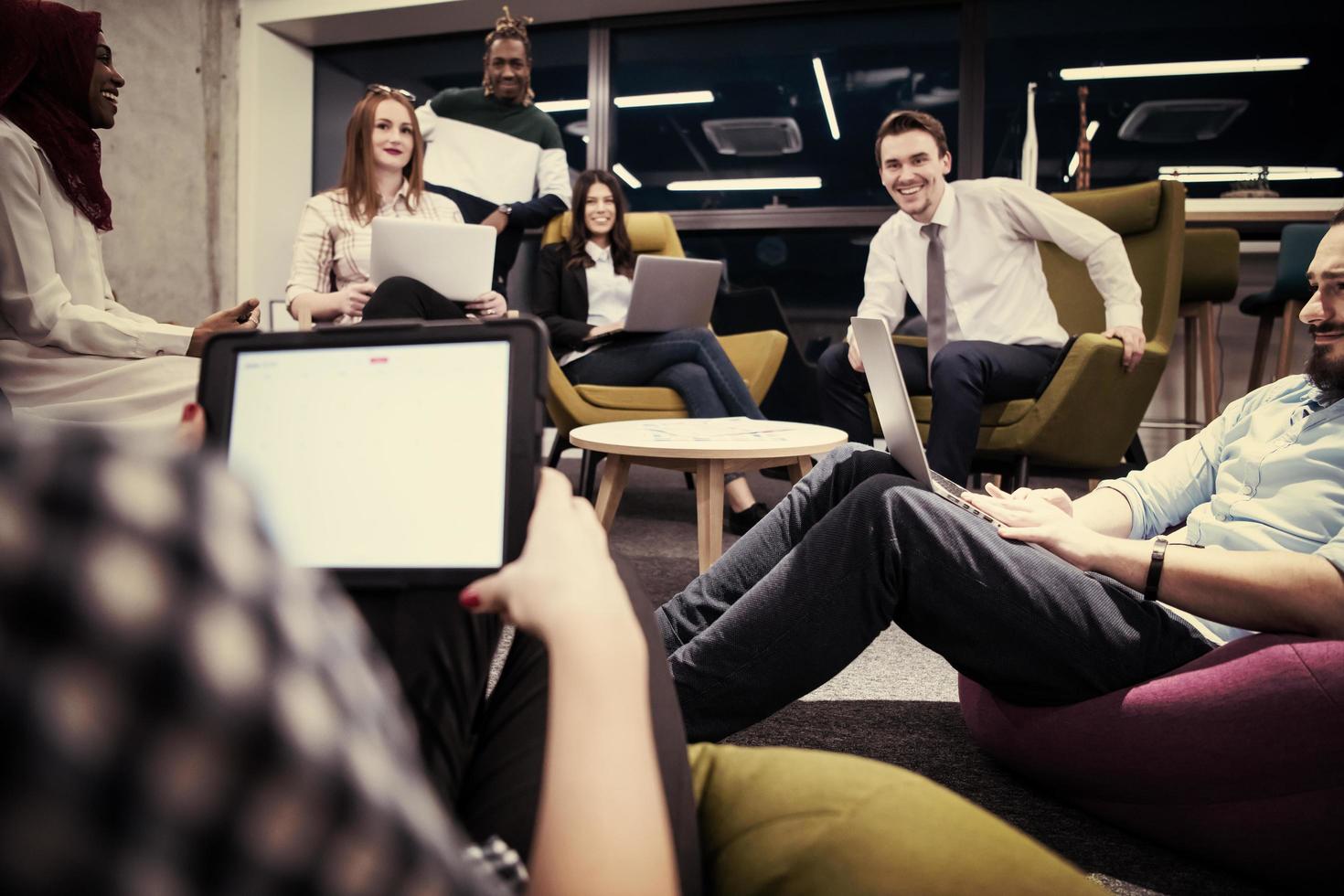 Multiethnic startup business team having meeting photo