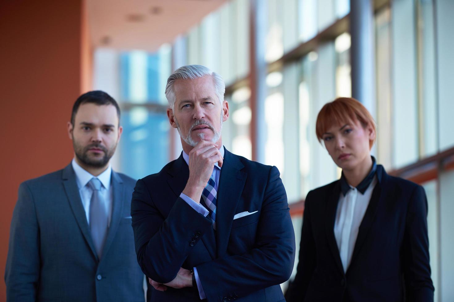 senior business man with his team at office photo