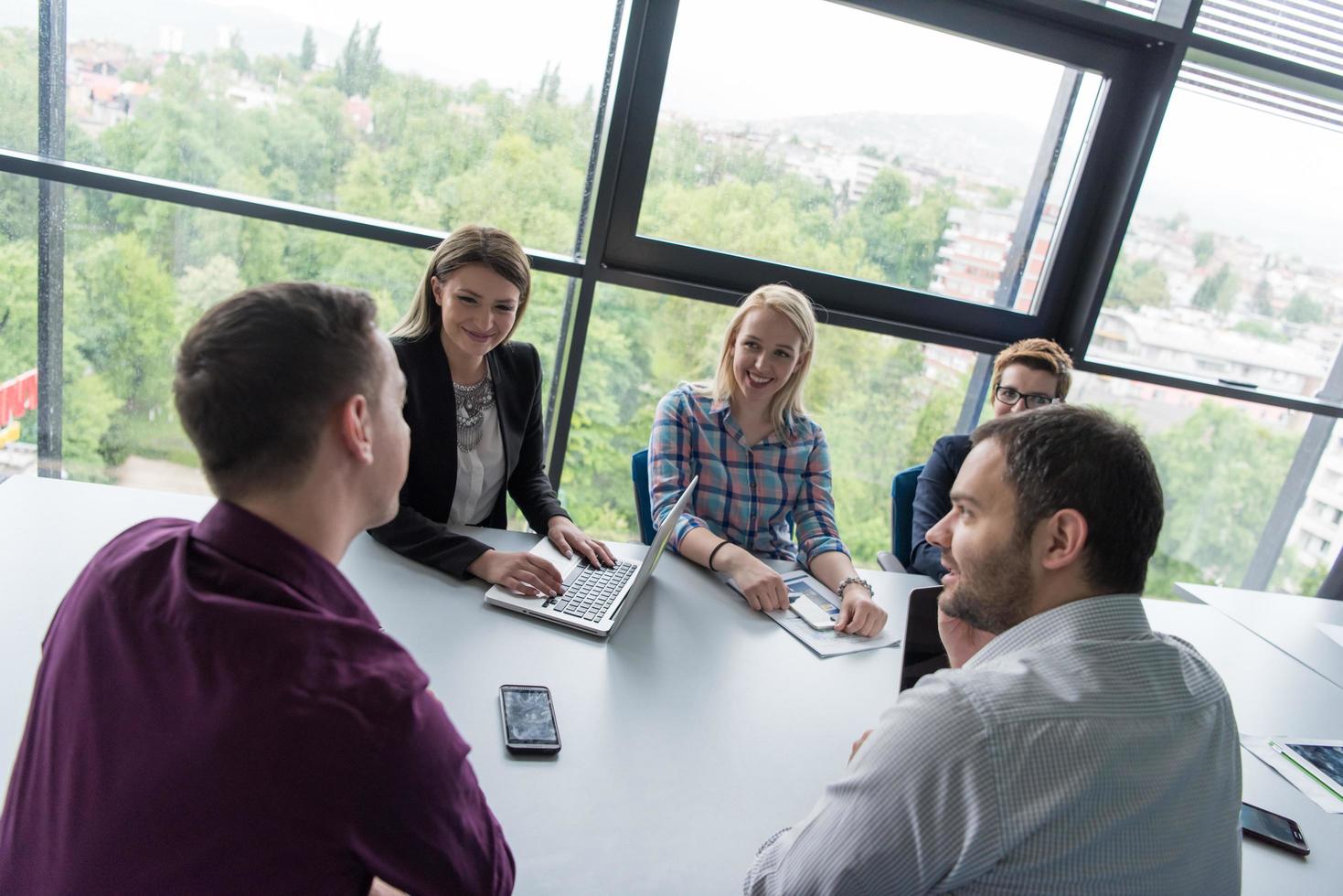 Group of young people meeting in startup office photo