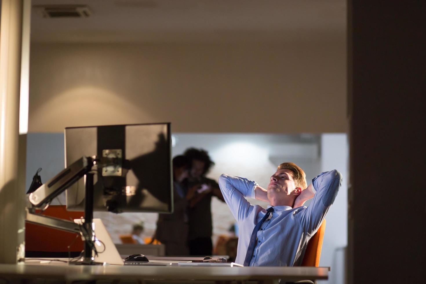 businessman relaxing at the desk photo
