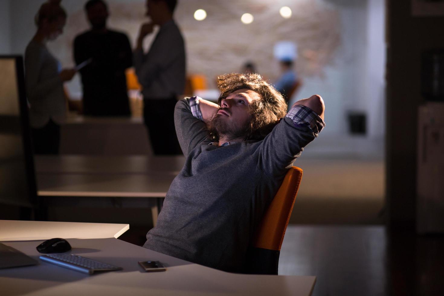 businessman relaxing at the desk photo