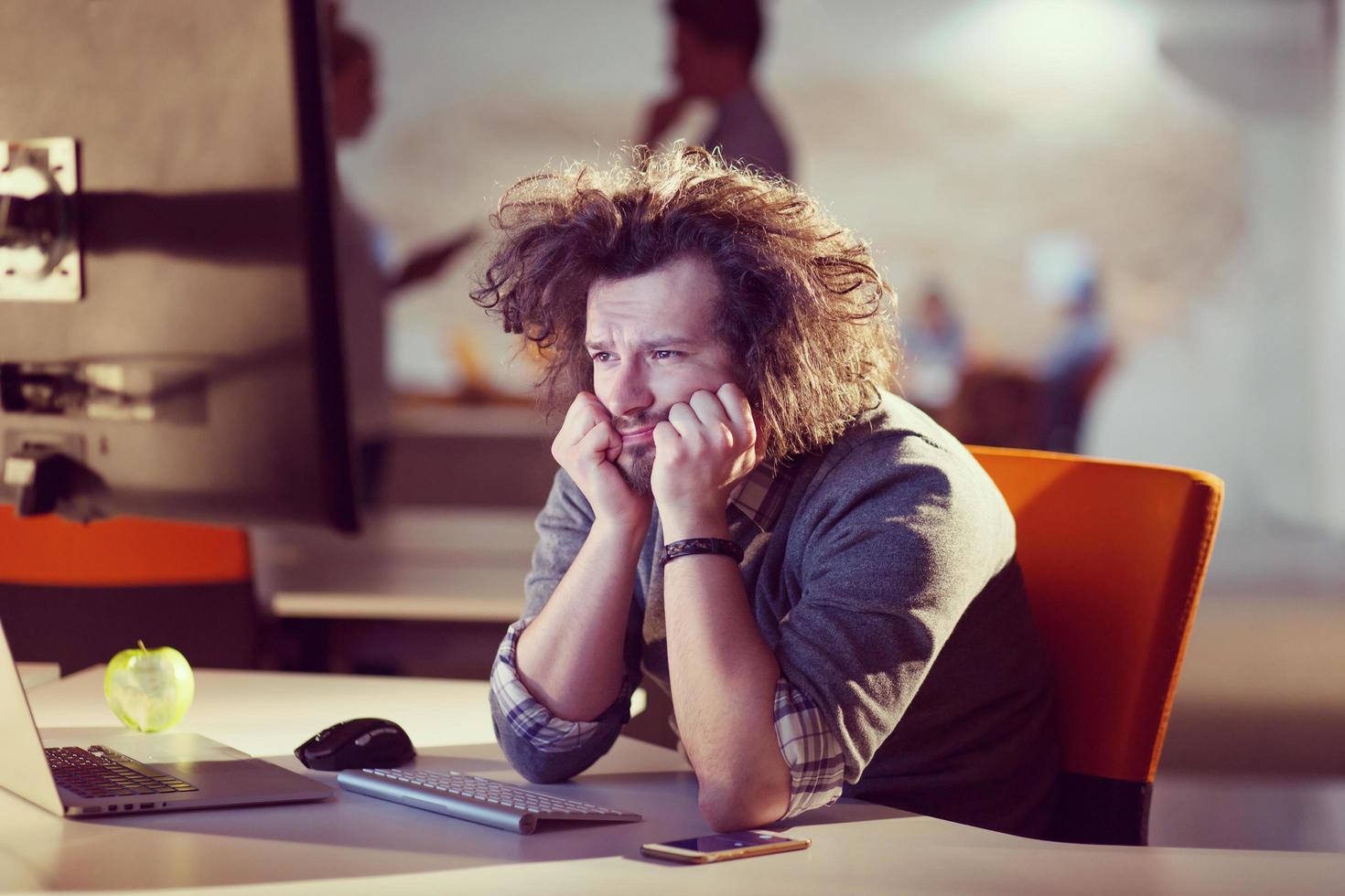 businessman relaxing at the desk photo