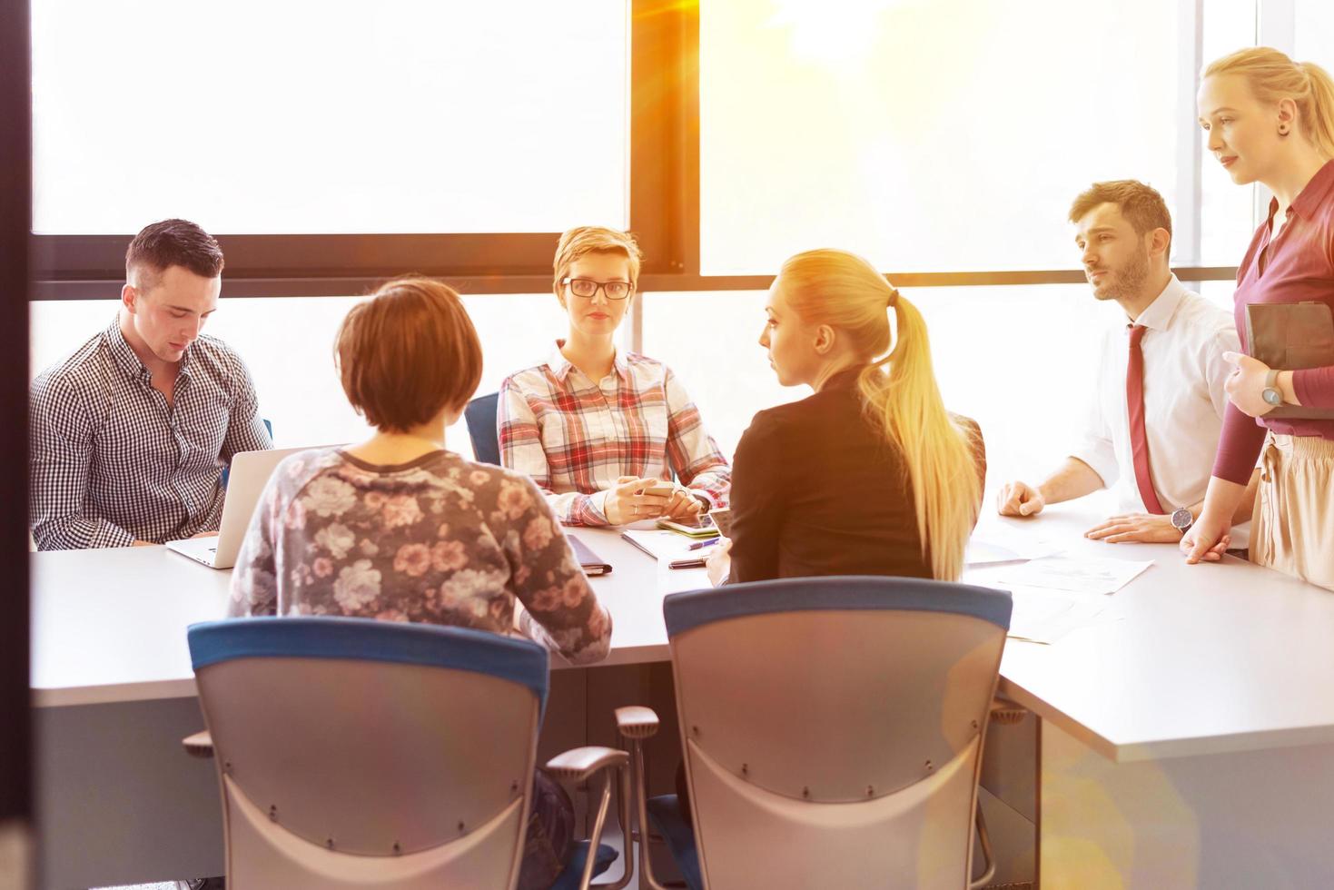 startup business team on meeting at modern office with sunset in background photo