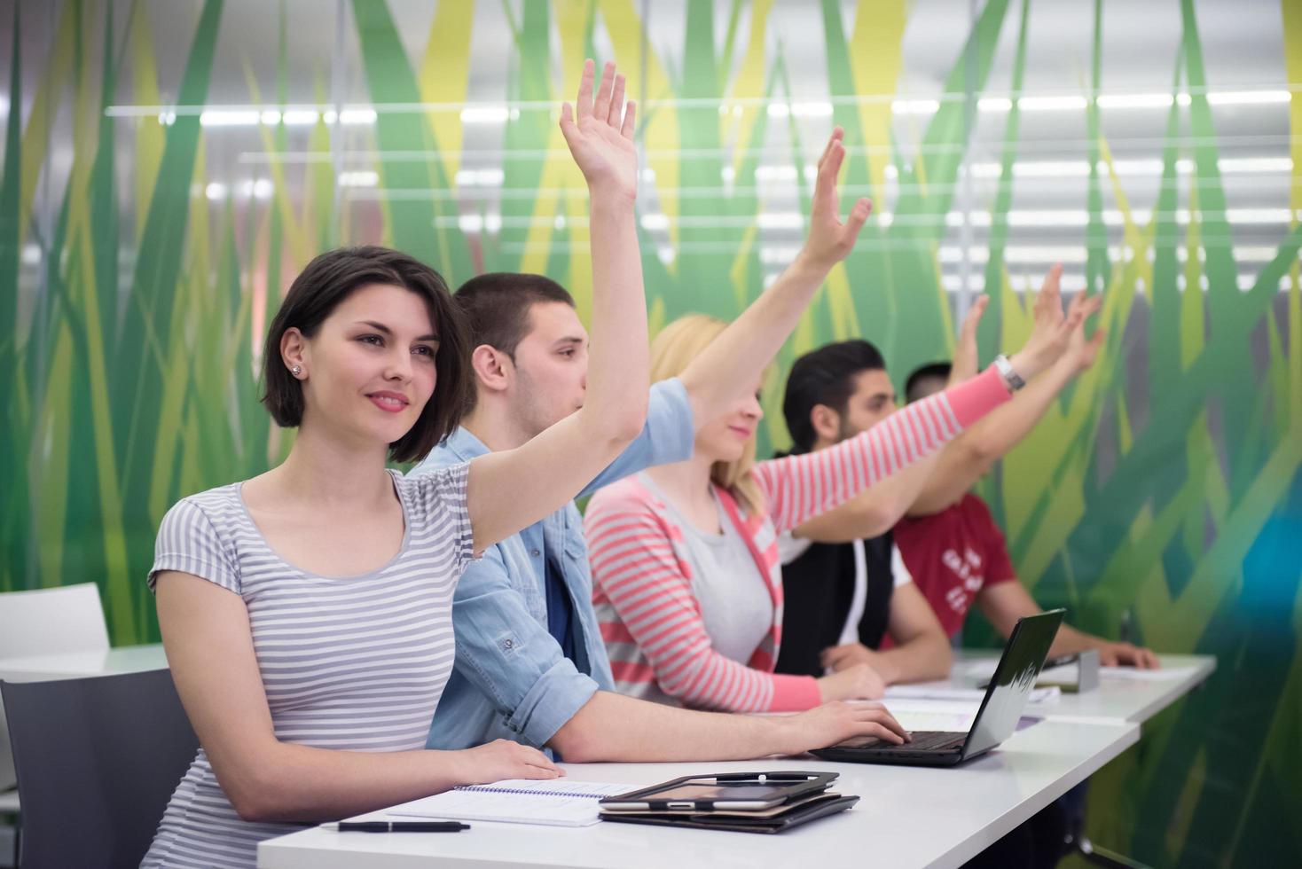 students group raise hands up photo