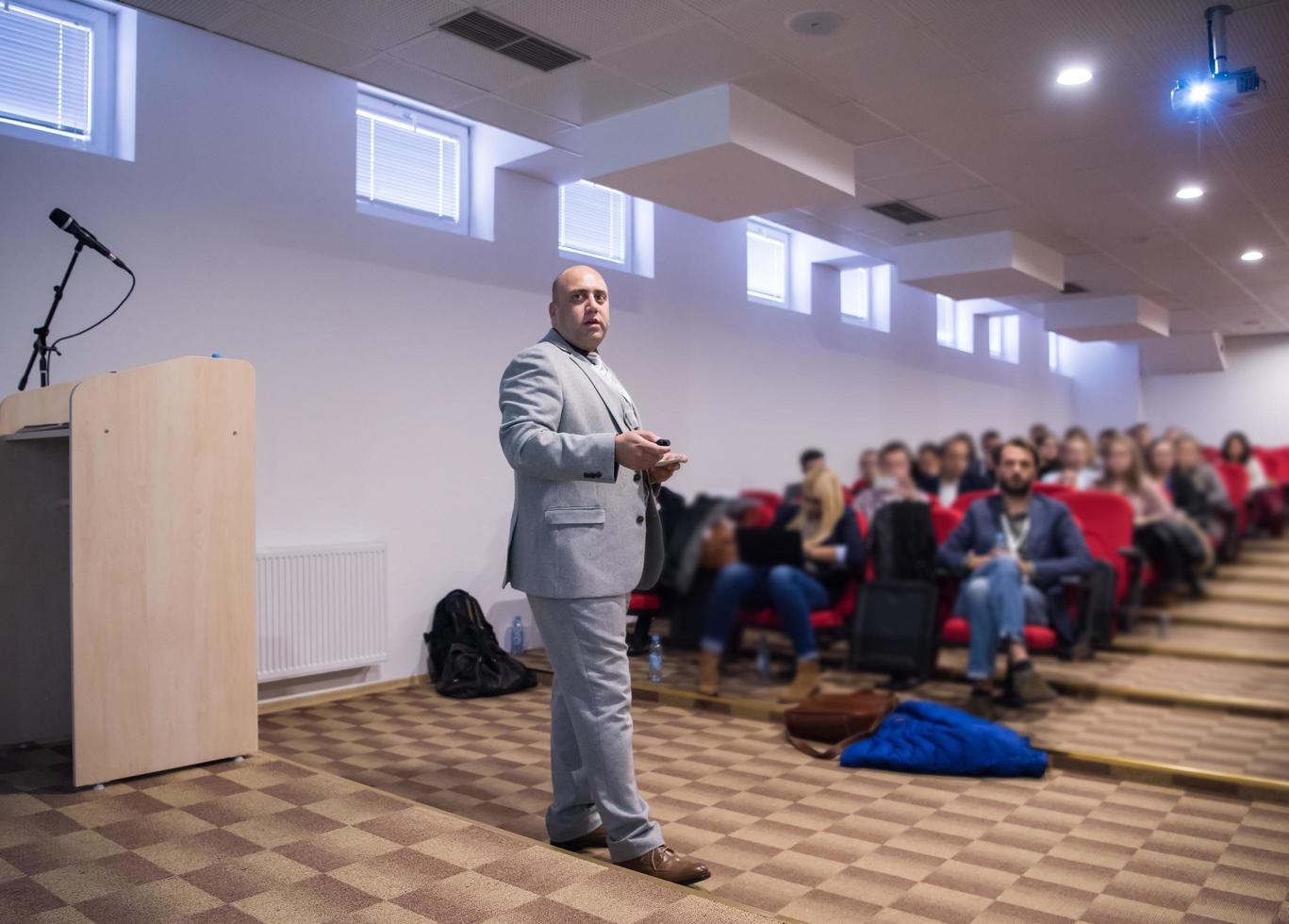 successful businessman giving presentations at conference room photo