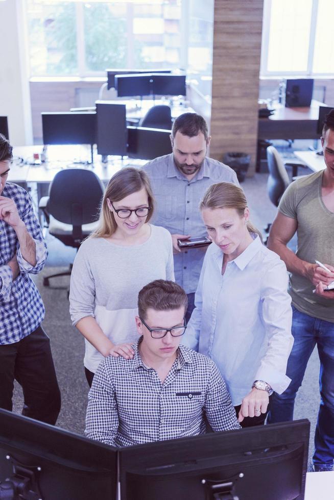startup business people group working as team to find solution photo
