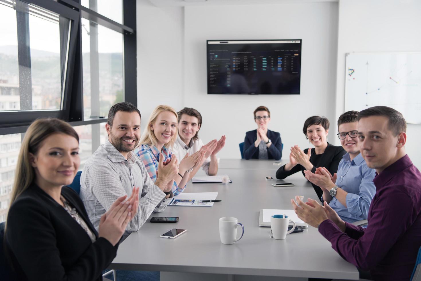 Group of young people meeting in startup office photo