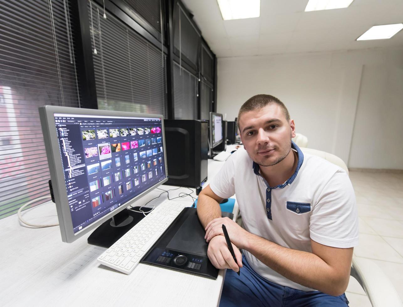 photo editor at his desk