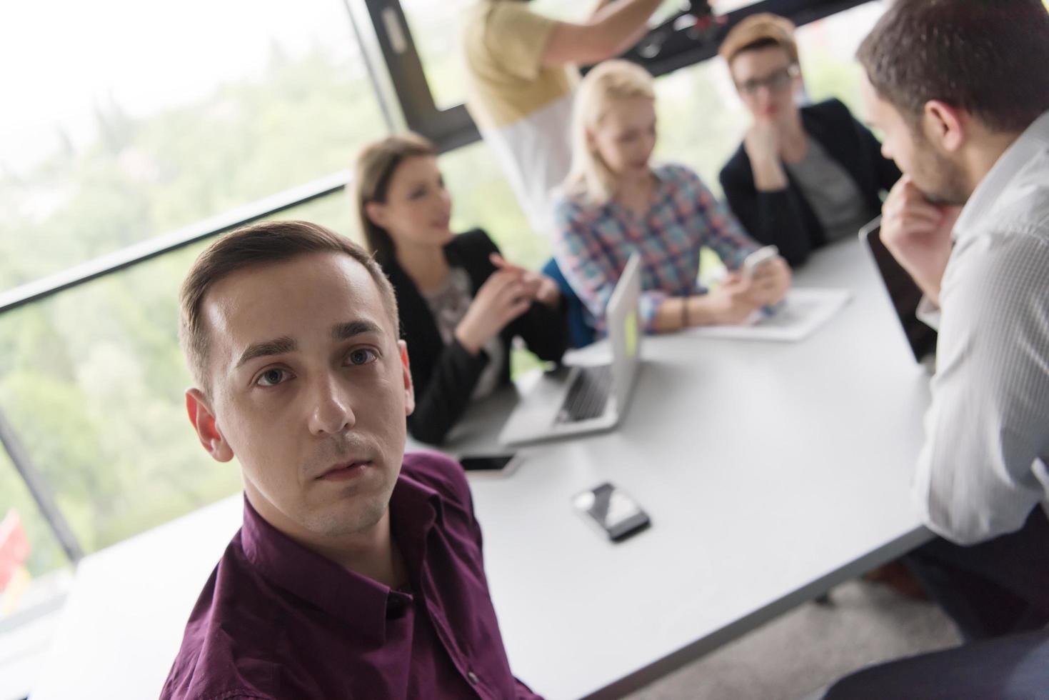 Group of young people meeting in startup office photo