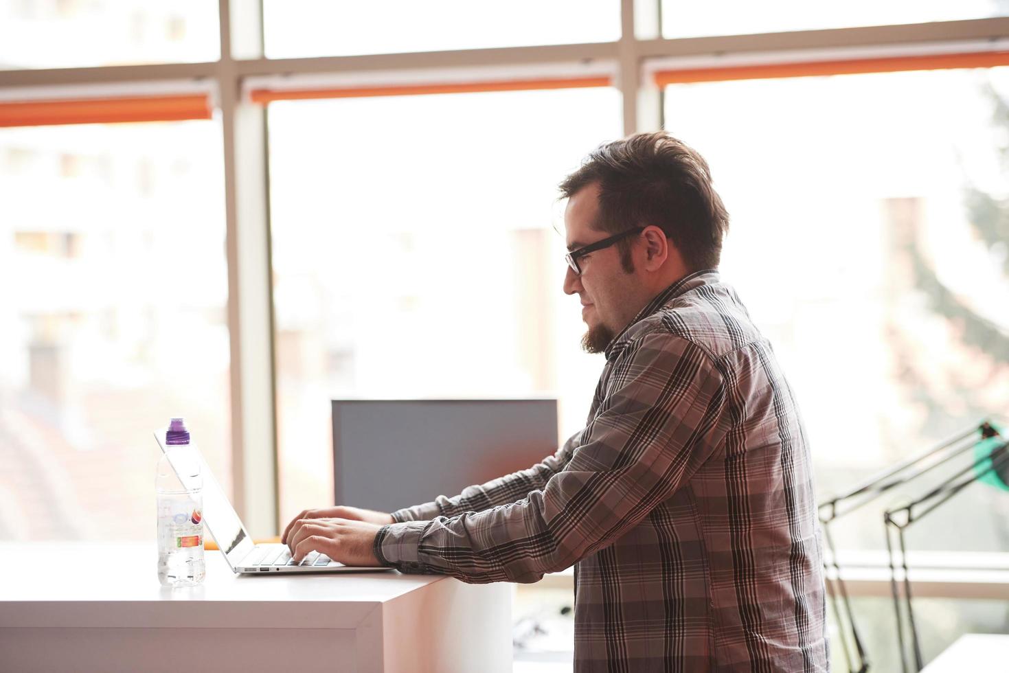 startup business, software developer working on computer photo