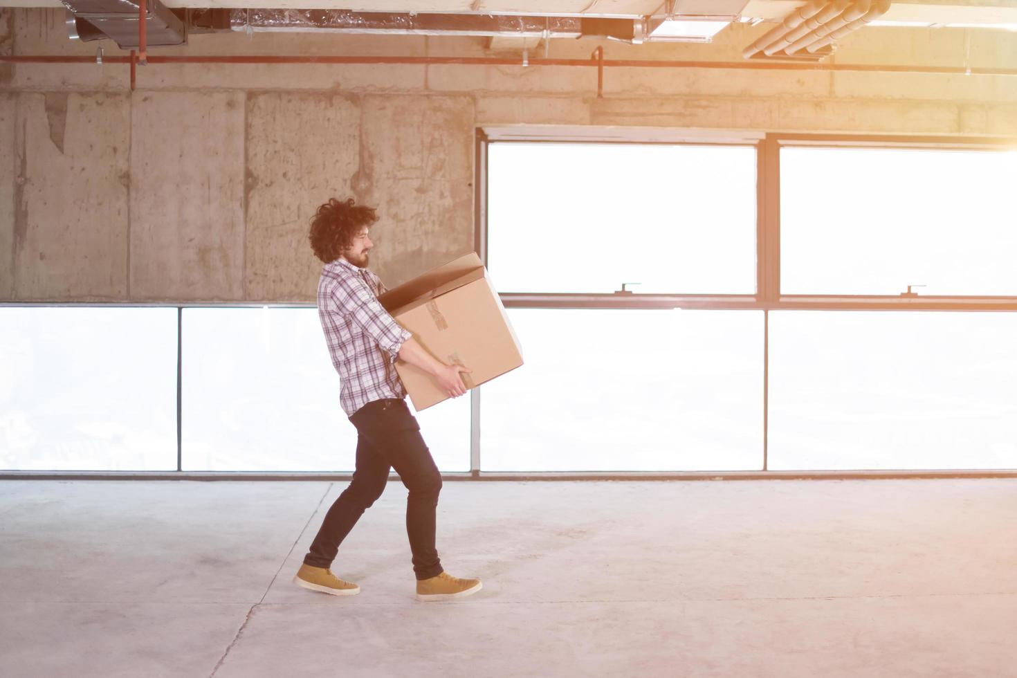 business man carrying cardboard box photo