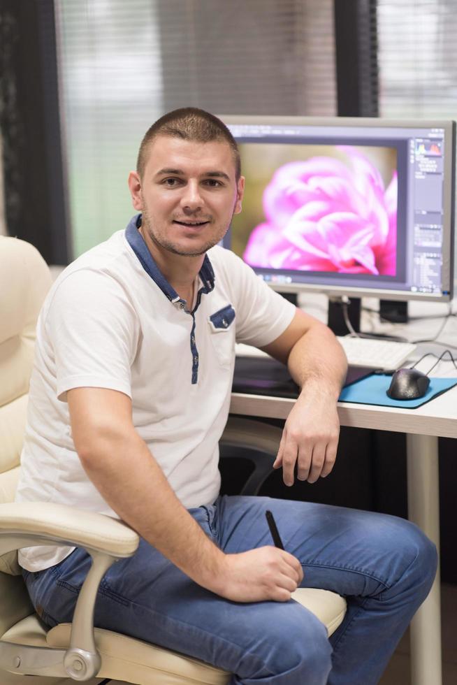 photo editor at his desk
