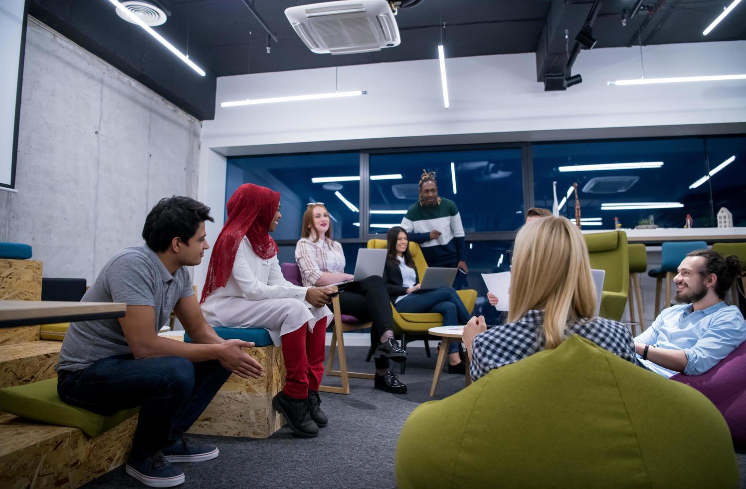 Multiethnic startup business team having meeting photo