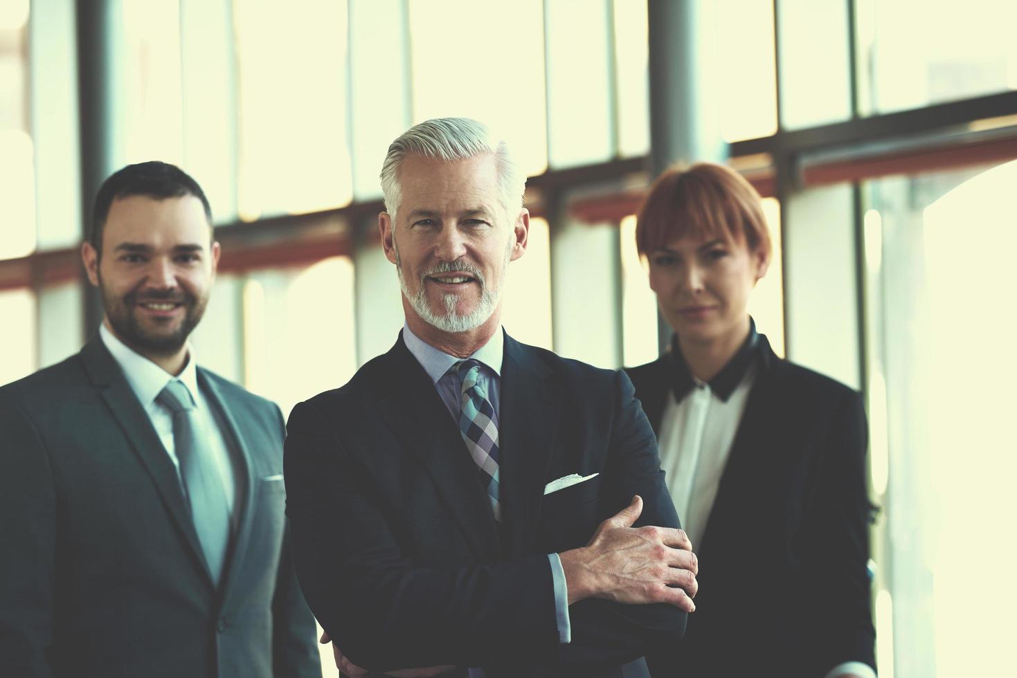 senior business man with his team at office photo