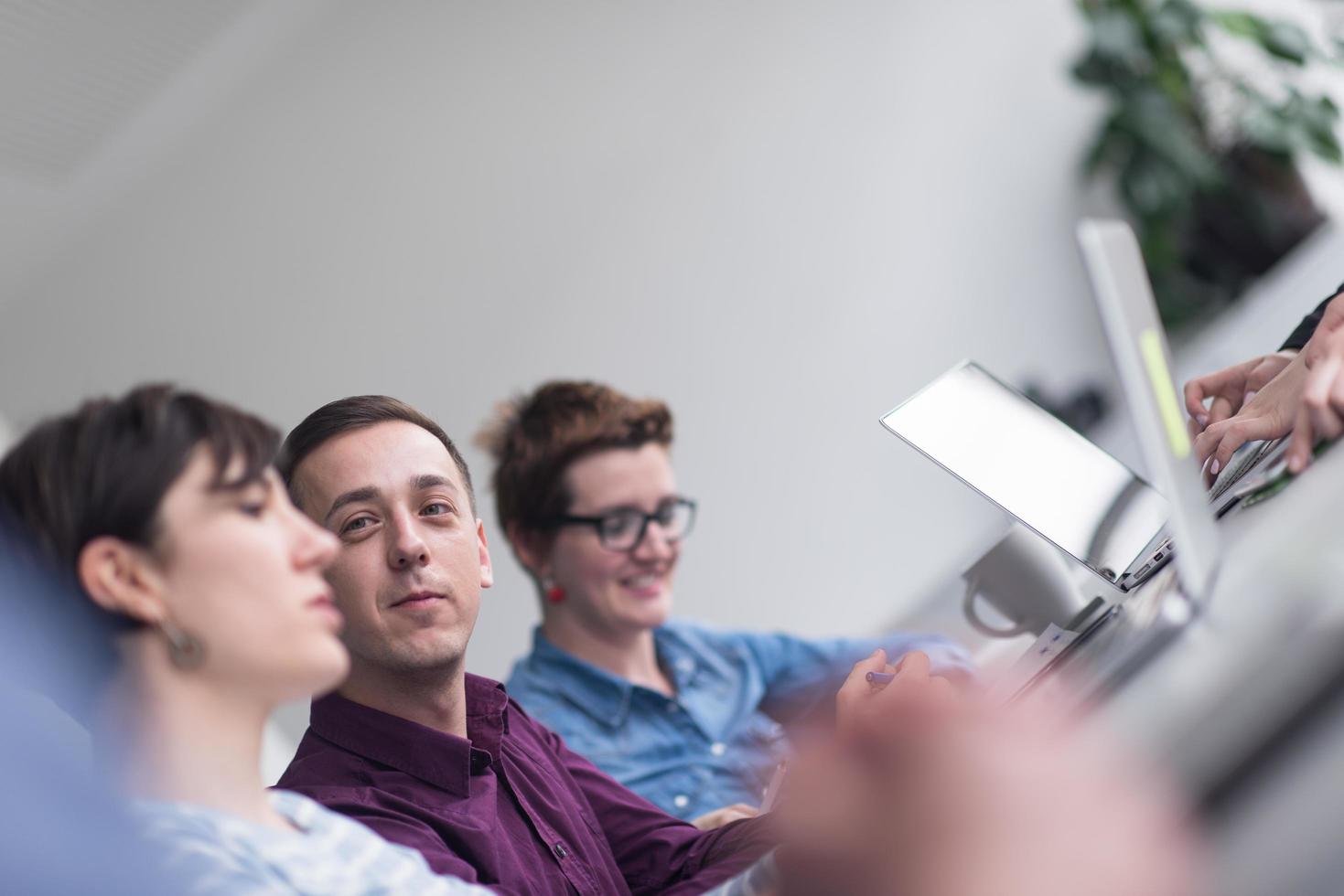 Group of young people meeting in startup office photo