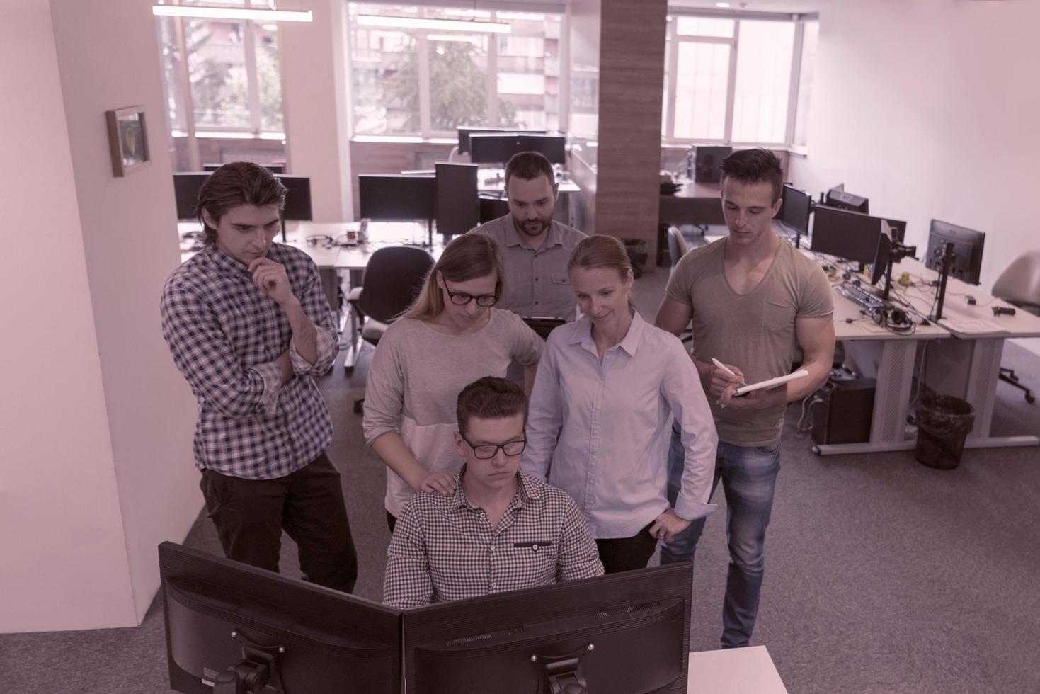 startup business people group working as team to find solution photo