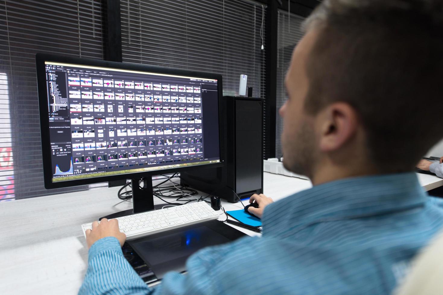 photo editor at his desk