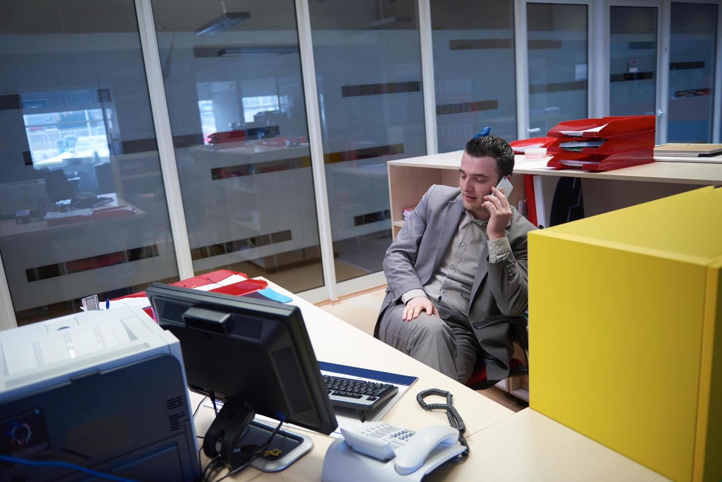 business man talking by phone in office photo