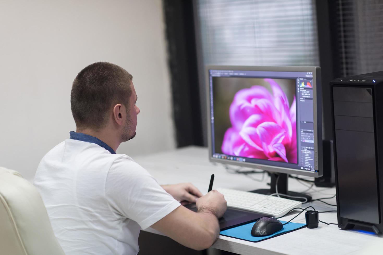 photo editor at his desk