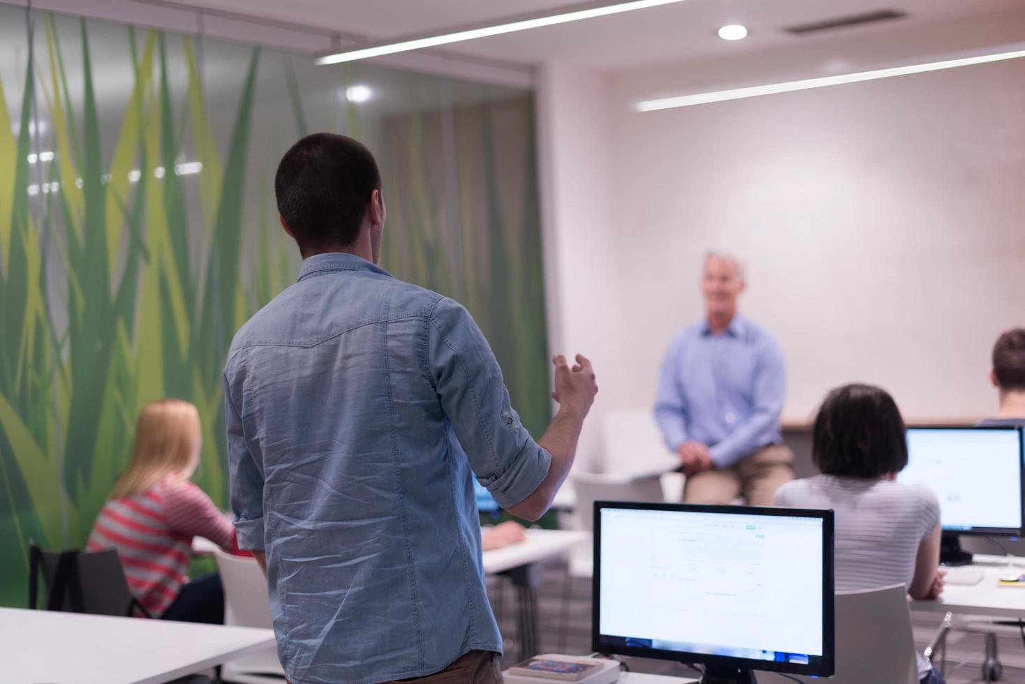 student answering a question in classroom photo