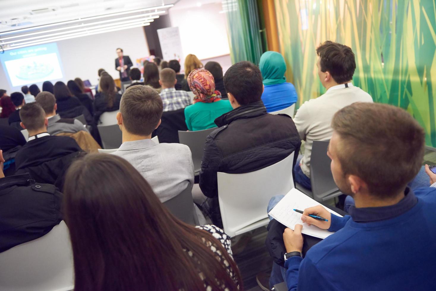 taking notes on business conference photo