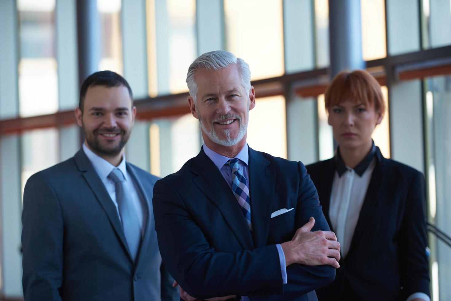 senior business man with his team at office photo