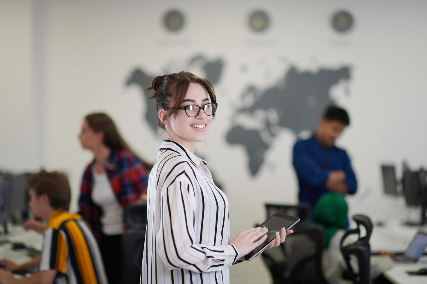 portrait of businesswoman holding tablet computer photo