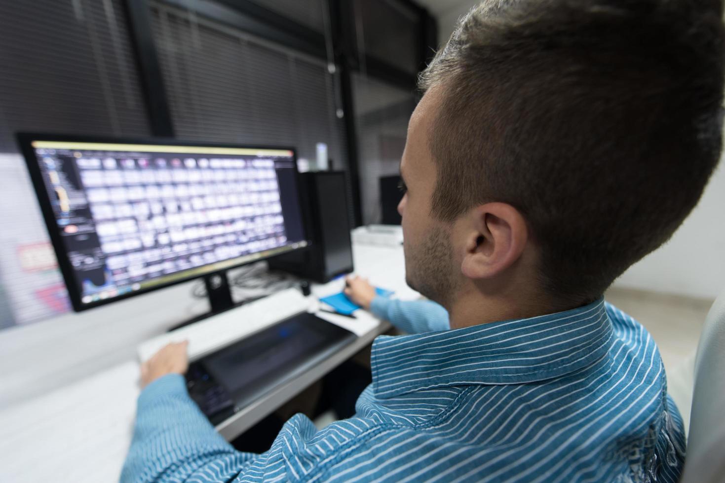 photo editor at his desk