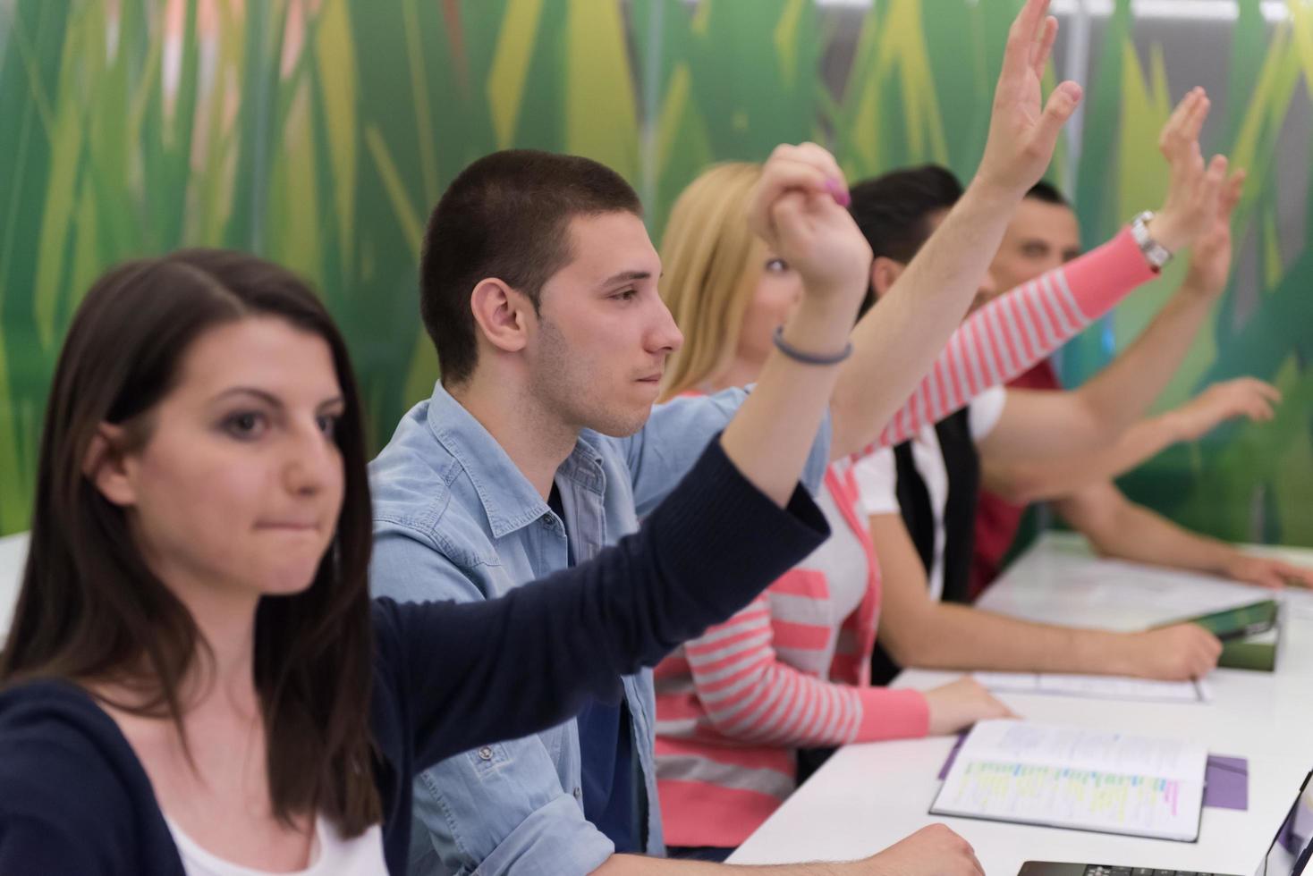 students group raise hands up photo