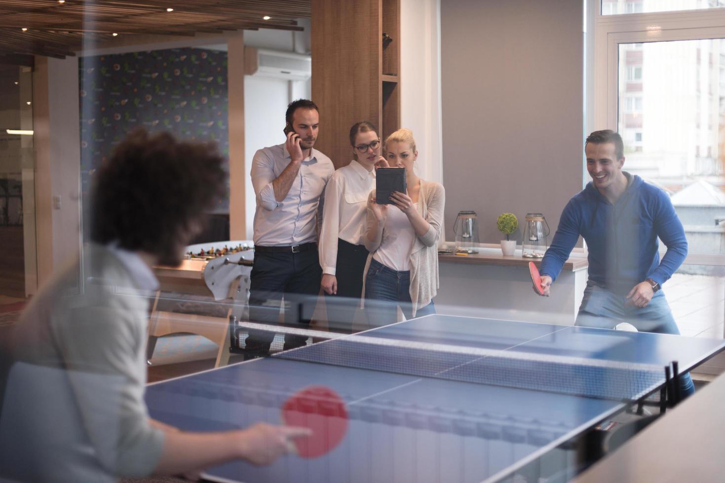startup business team playing ping pong tennis photo