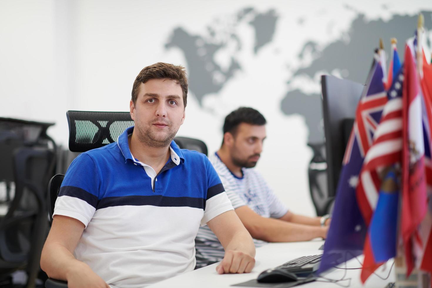 two male software developers working on computer photo