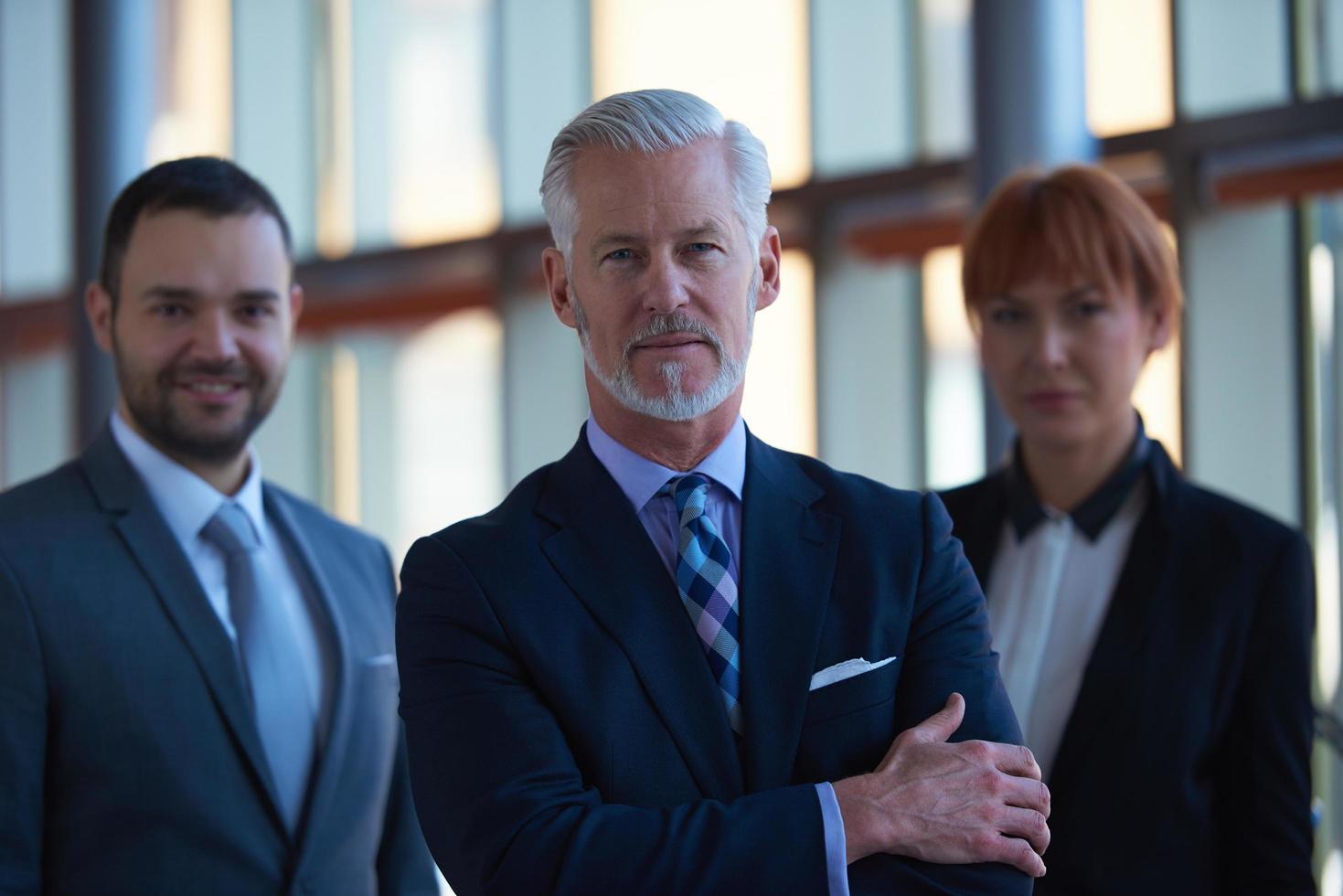 senior business man with his team at office photo