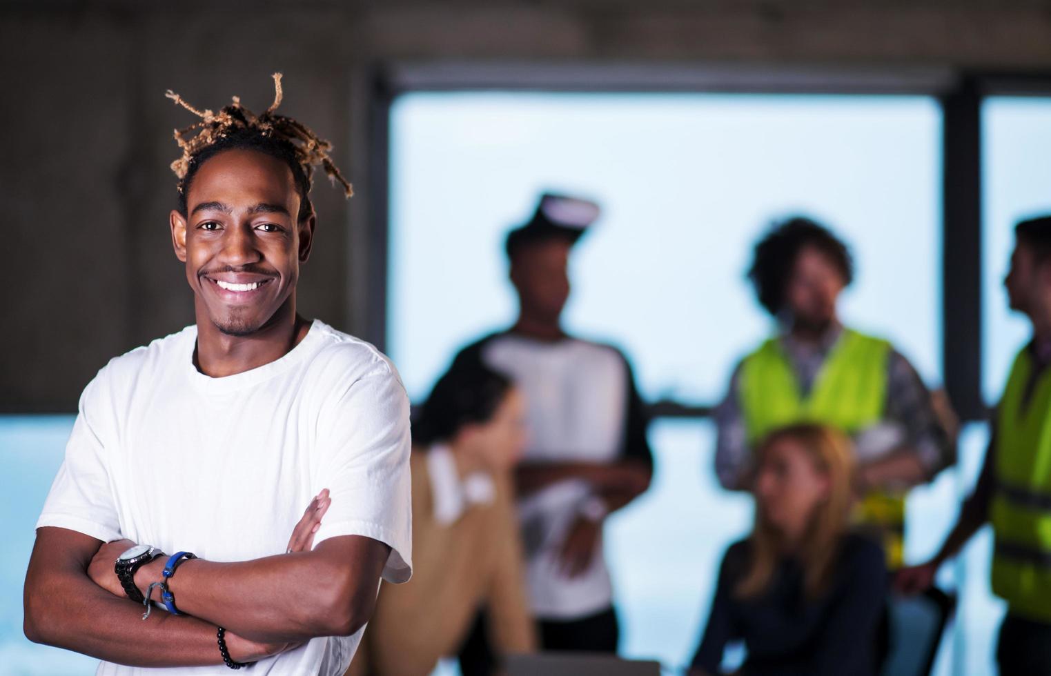 portrait of young casual black businessman on construction site photo