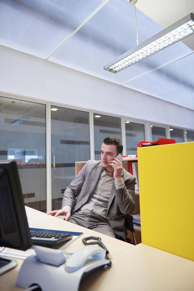 business man talking by phone in office photo