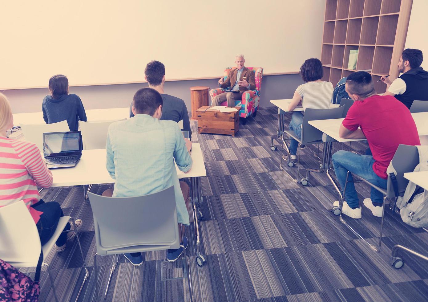 teacher with a group of students in classroom photo