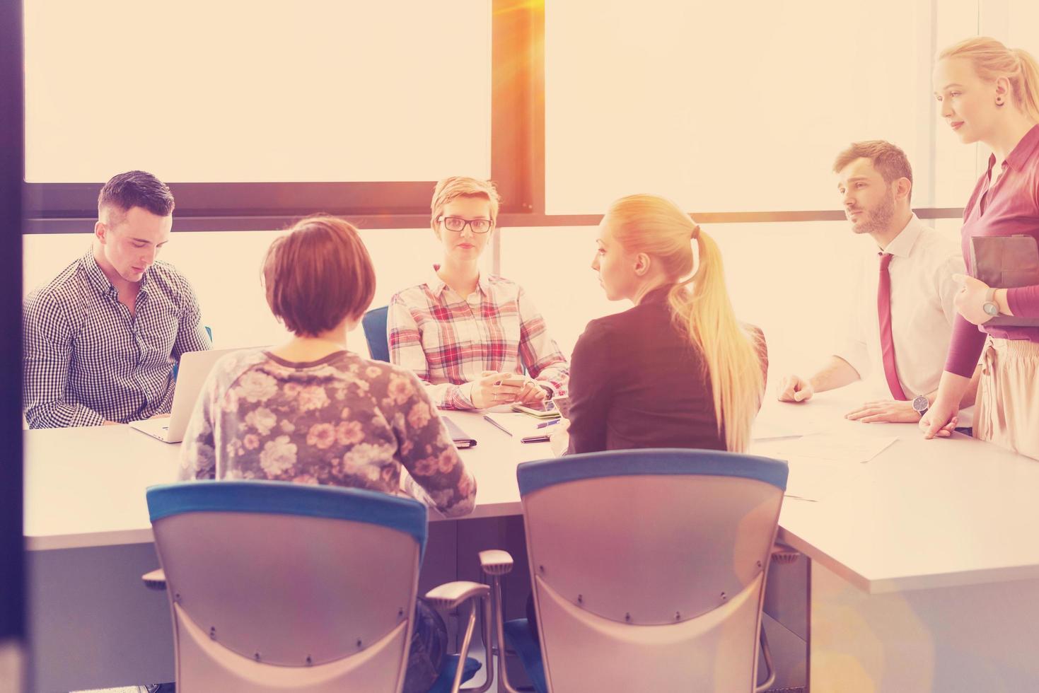 startup business team on meeting at modern office with sunset in background photo