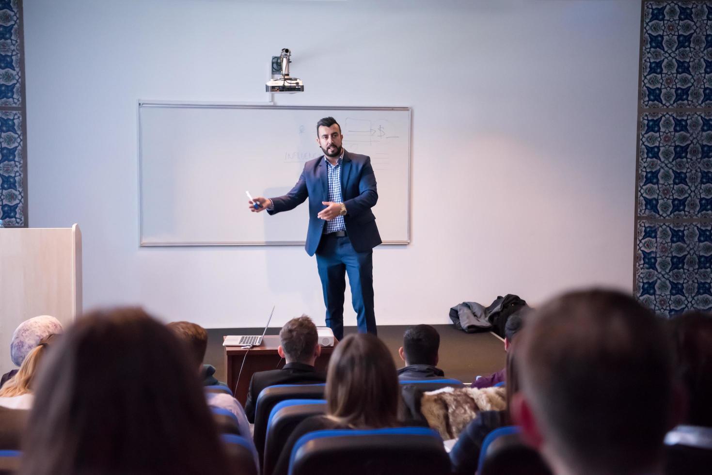 successful businessman giving presentations at conference room photo
