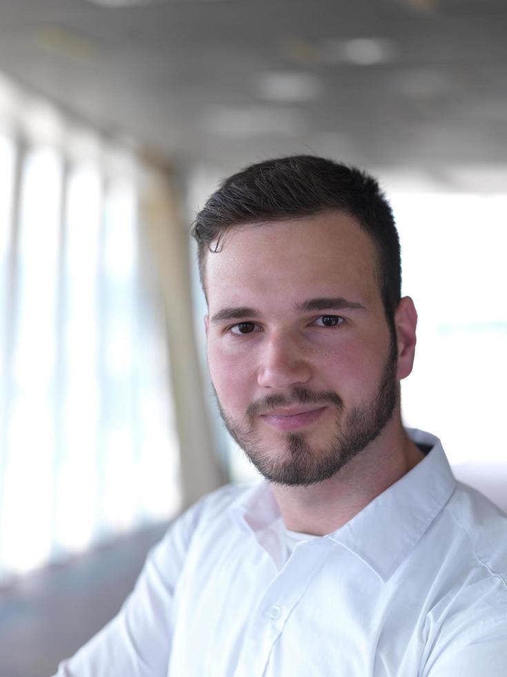 portrait of young  business man with beard at modern office photo