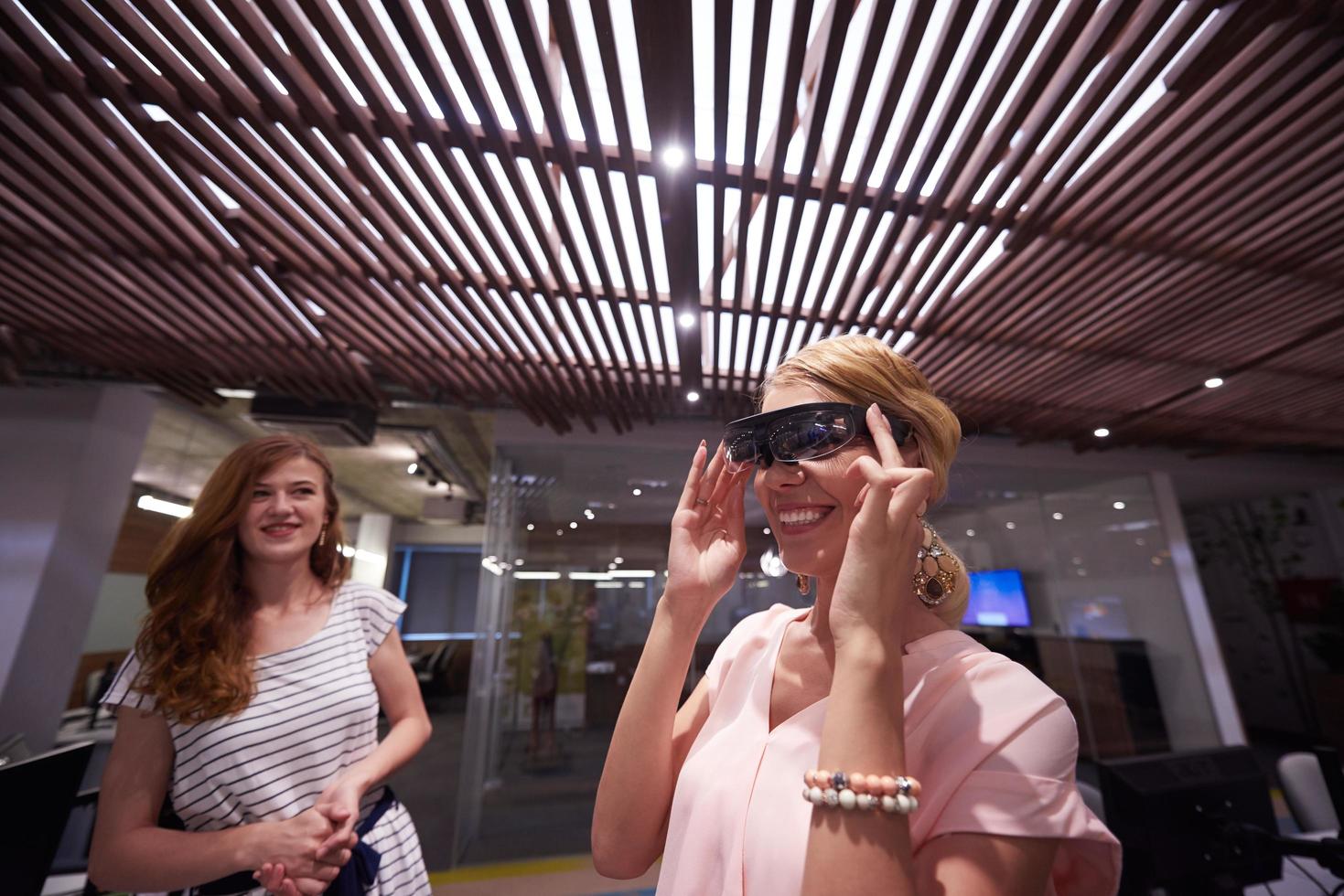 woman using virtual reality gadget computer glasses photo