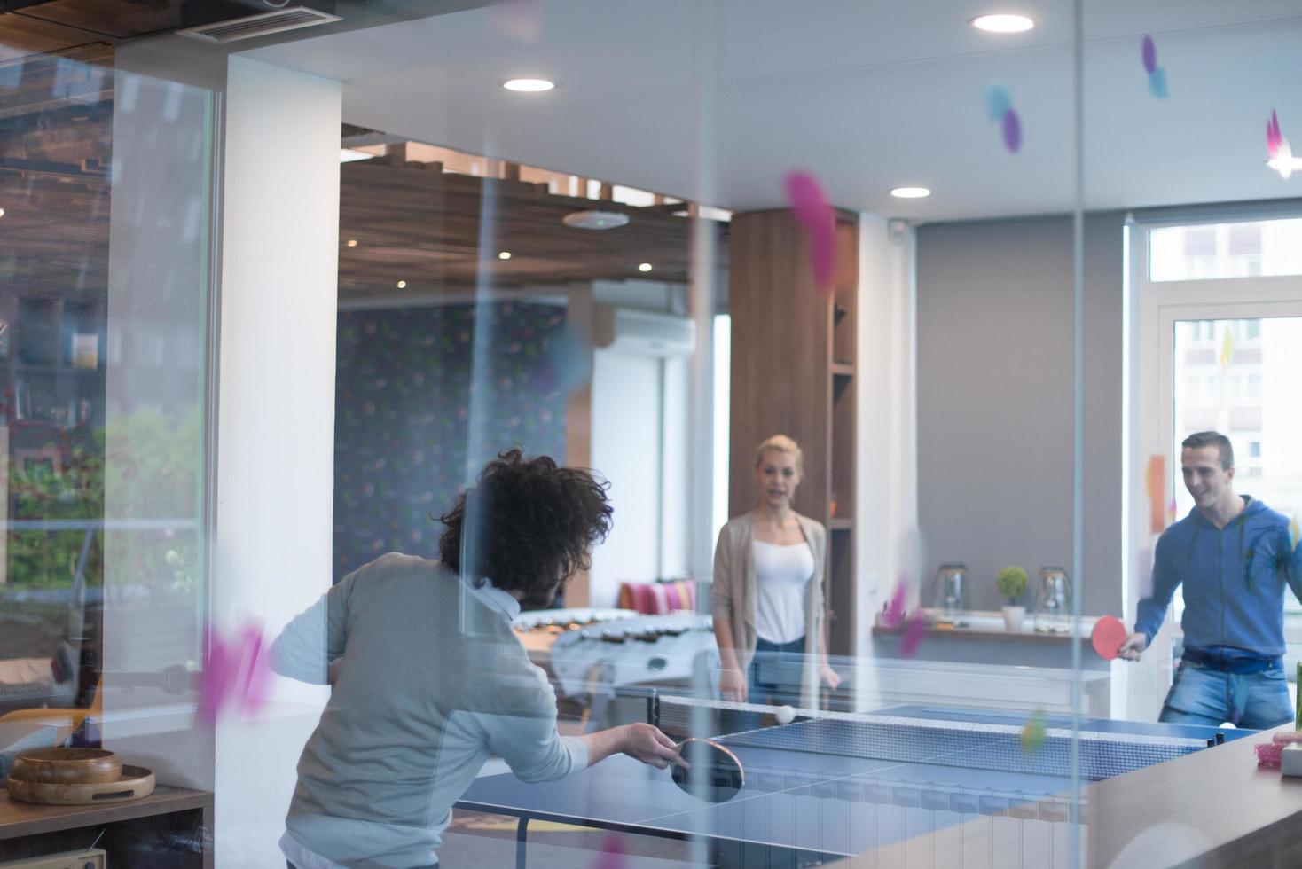 startup business team playing ping pong tennis photo