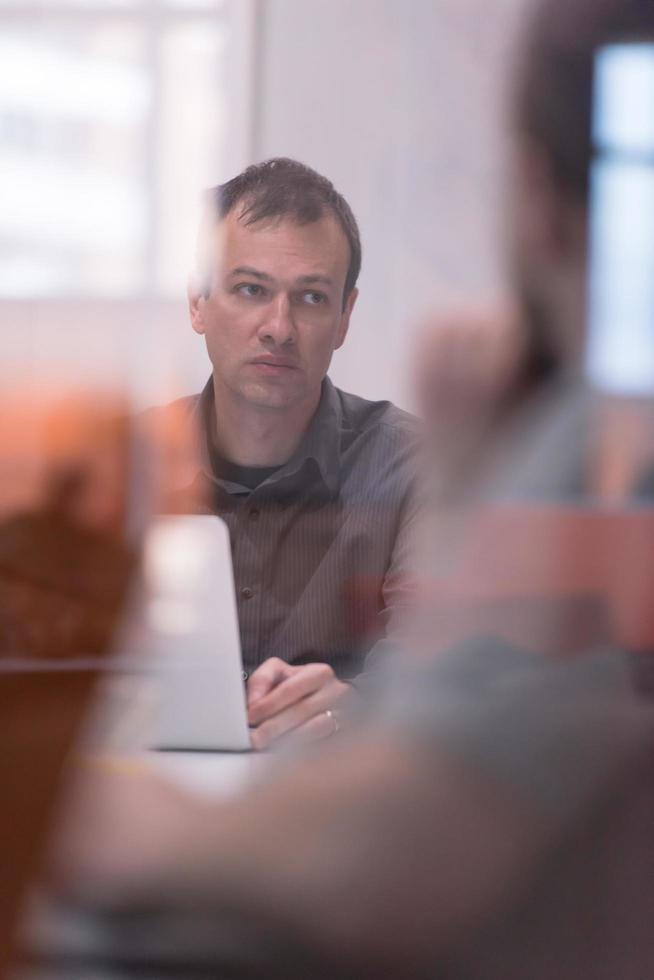 businessman working using a laptop in startup office photo