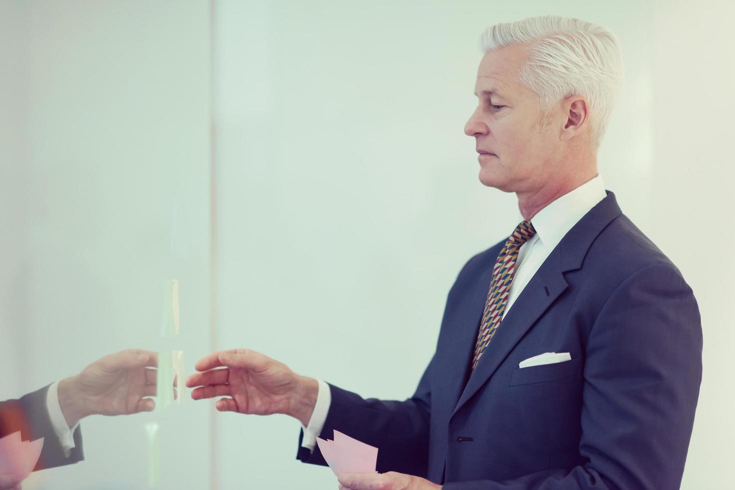 senior business man making plans with sticker photo